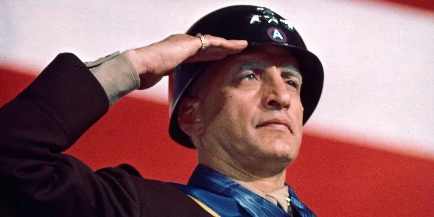 Patton saluting in front of an American flag in Patton.