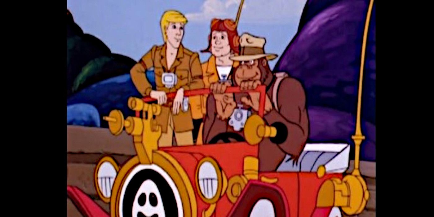 Spencer, Tracy, and Kong stand in or near their Ghost Buster car in The Ghost Busters