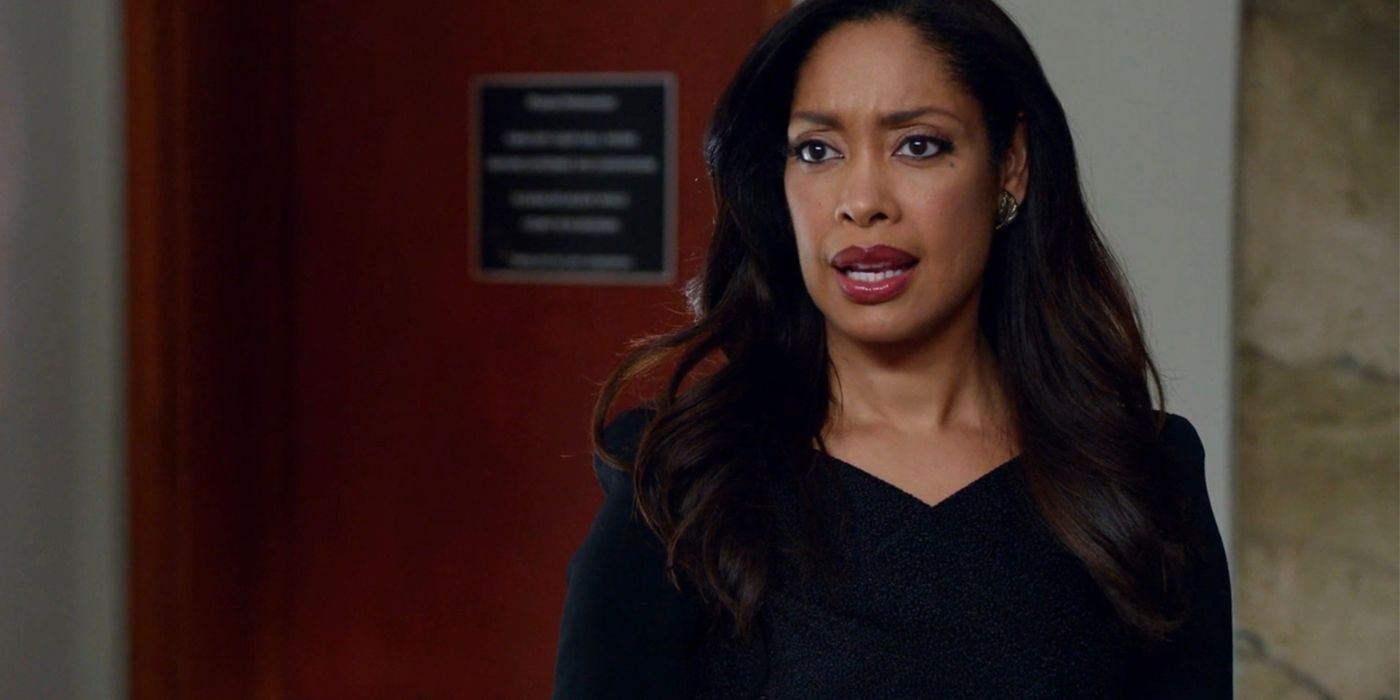 Gina Torres as Jessica Pearson standing outside a courtroom in Suits