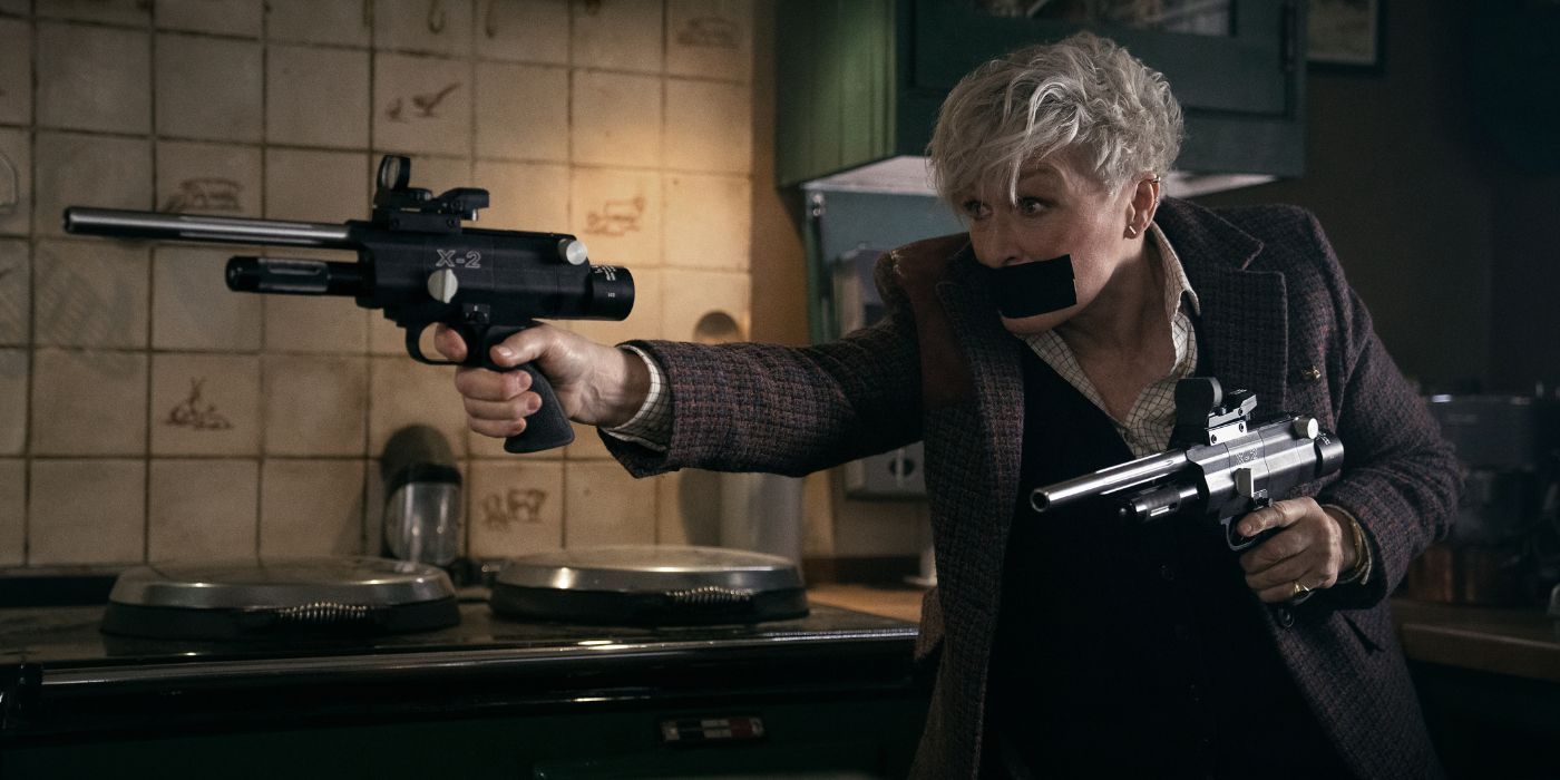 Glenn Close wielding two guns with black tape over her mouth in Back in Action.