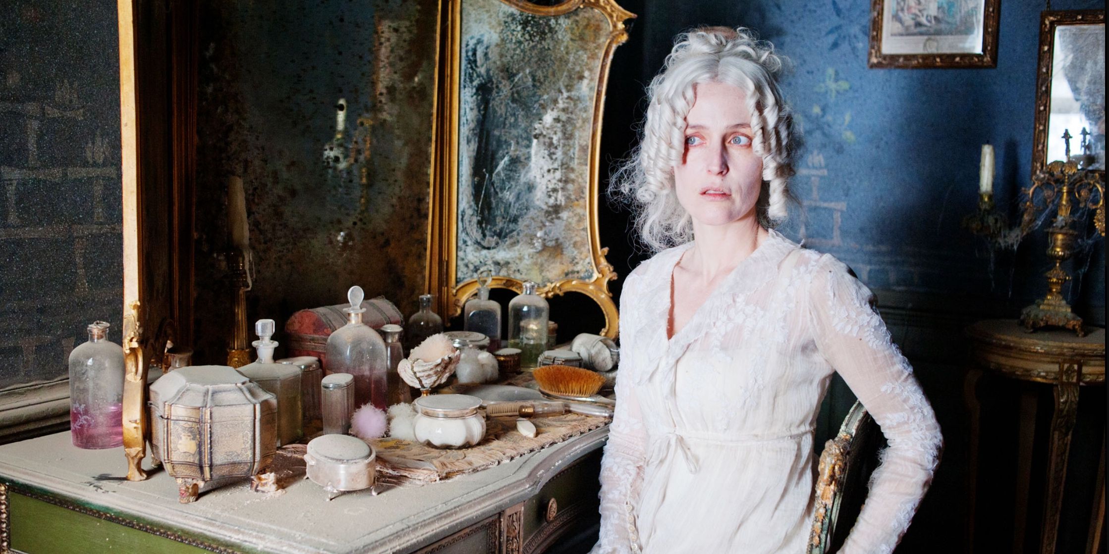 Miss Havisham, played by Gillian Anderson, sits at her vanity table in Satis House in 'Great Expecations' (2011)