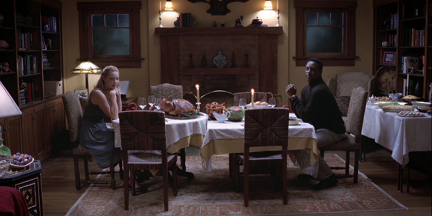 Katherine Heigl as Izzie sits at a Thanksgiving table with Isaiah Washington as Preston in Grey&rsquo;s Anatomy.