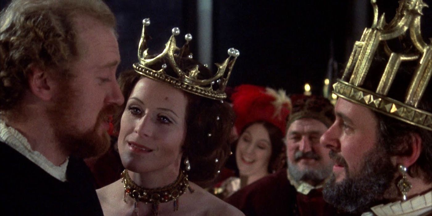 The king and queen wear large gold crowns and confront Hamlet in Hamlet (1969).