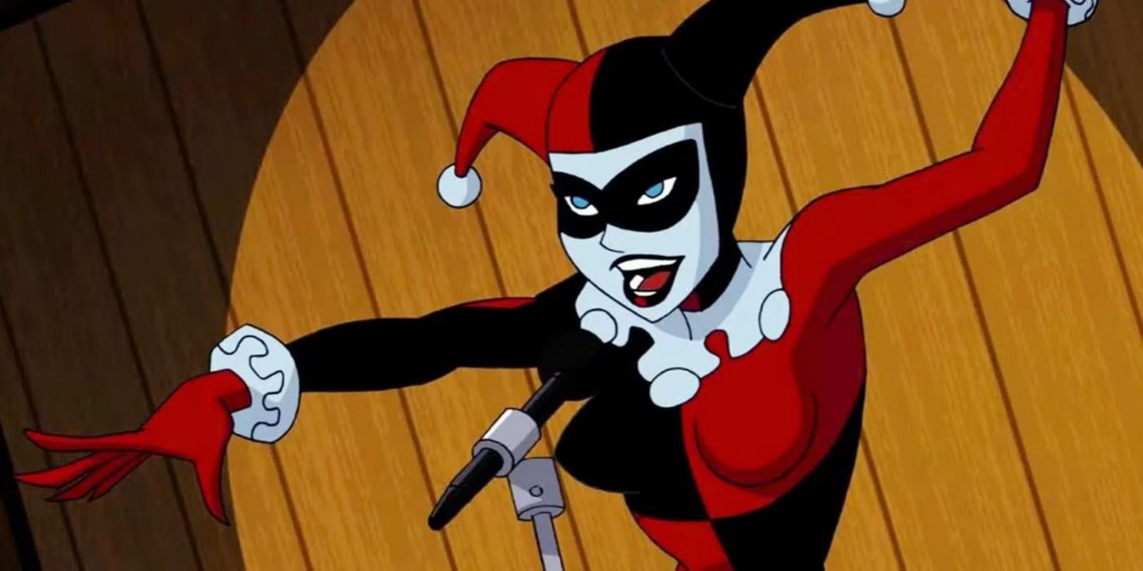 Harley Quinn talking into a microphone in Batman The Animated Series