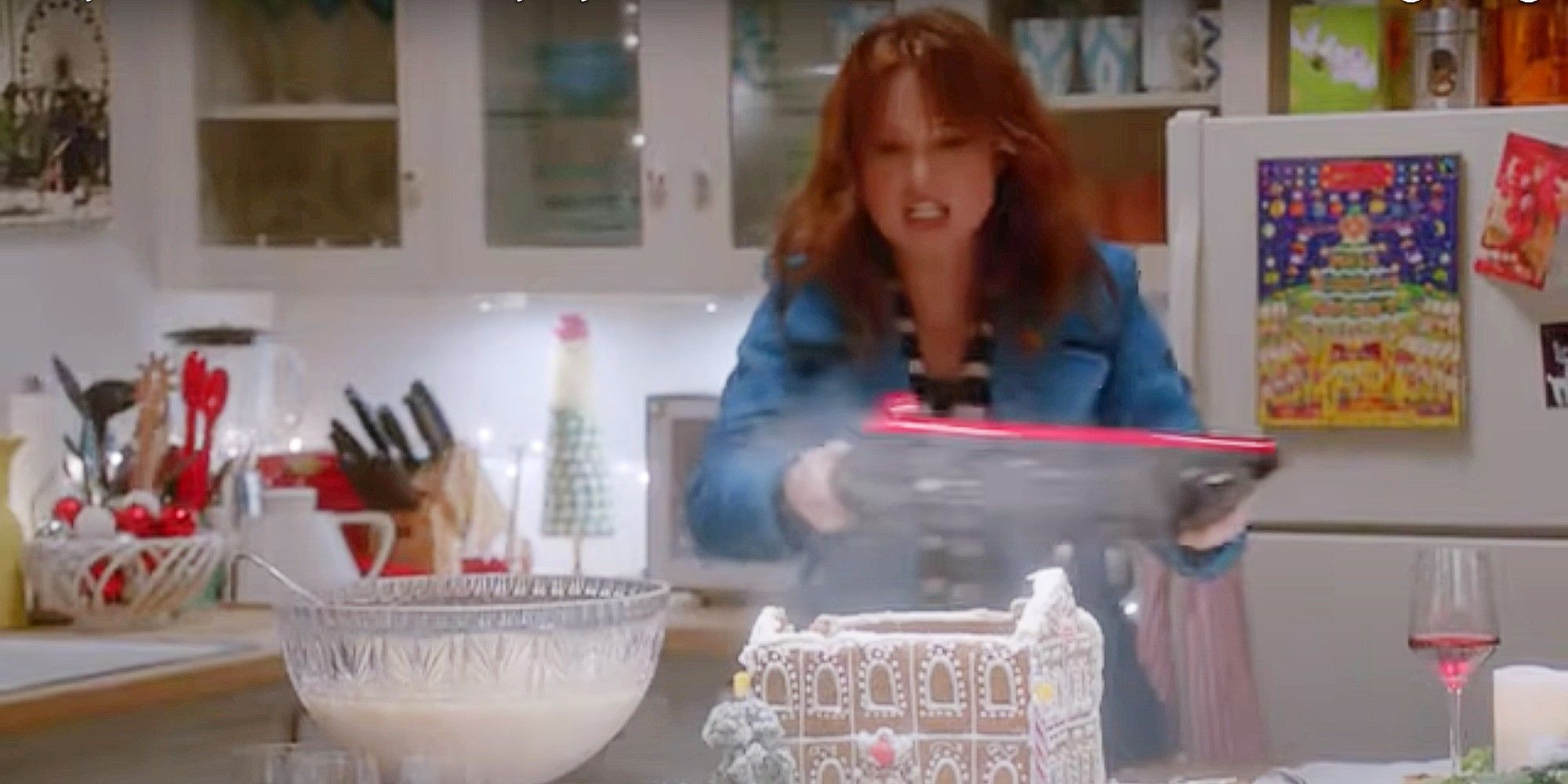 Heather smashing a gingerbread house in The Mindy Project Season 1 Christmas Episode