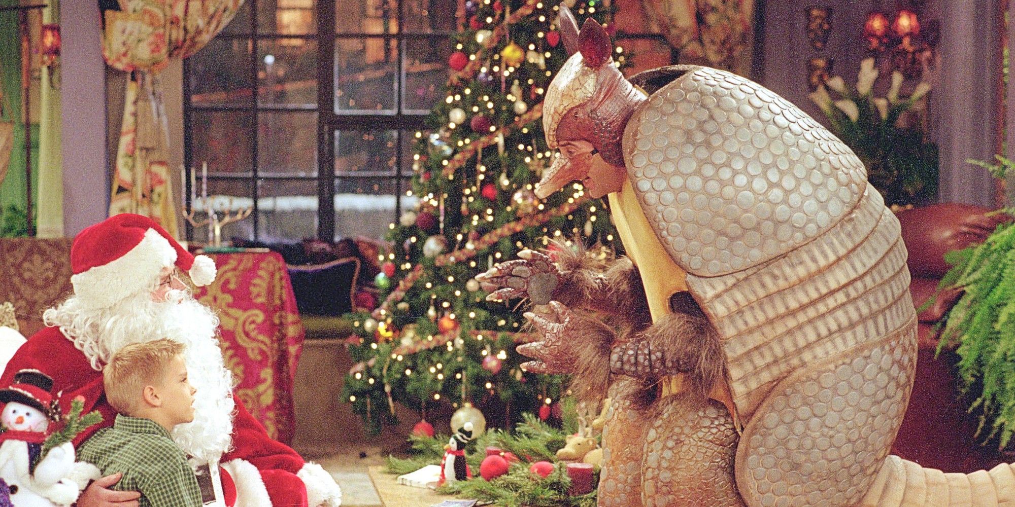 Ross as the Holiday Armadillo with Chandler as Santa next to Ben in a Christmas episode of Friends