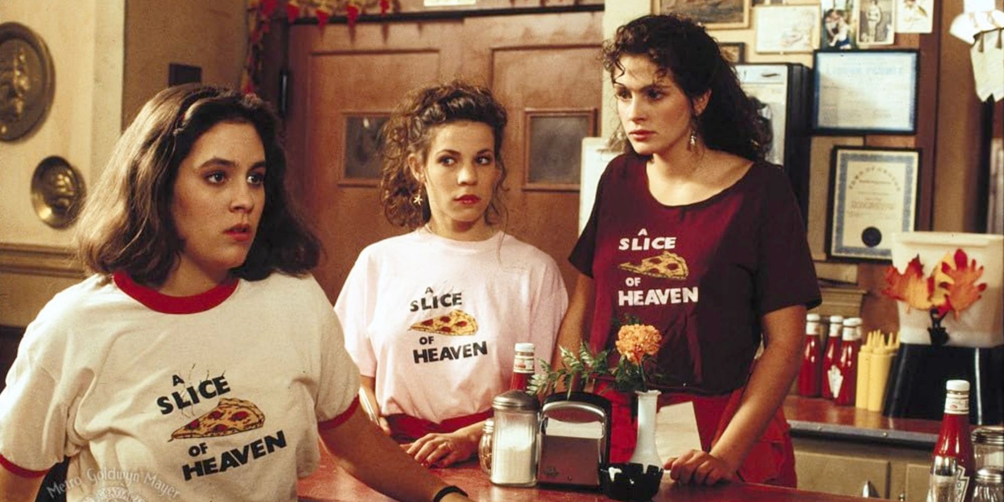 Kat (Annabeth Gish), Jojo (Lili Taylor) and Daisy (Julia Roberts) work at Mystic Pizza in the movie &lsquo;Mystic Pizza.'