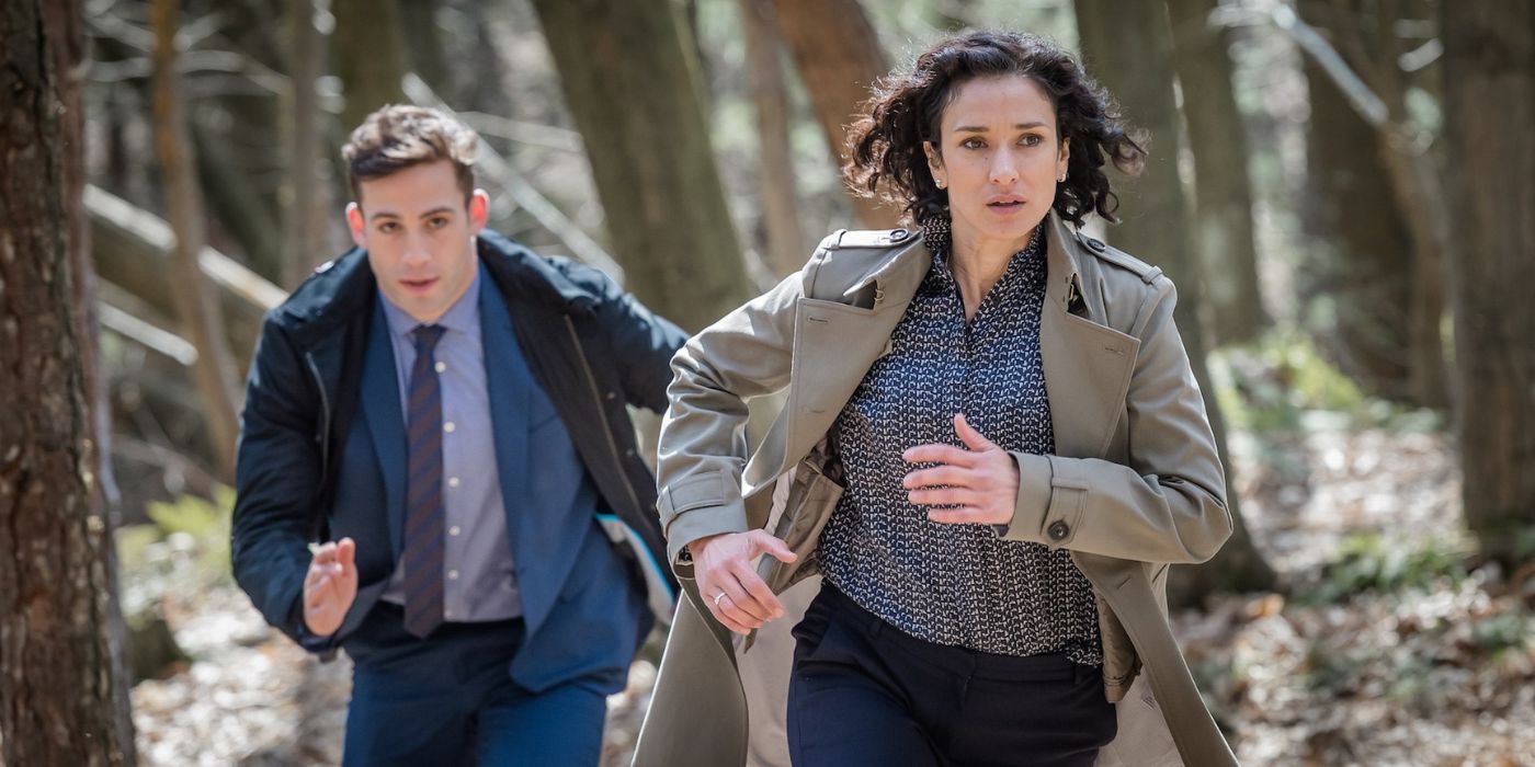 Indira Varma and Dino Fetscher running through the woods in Paranoid