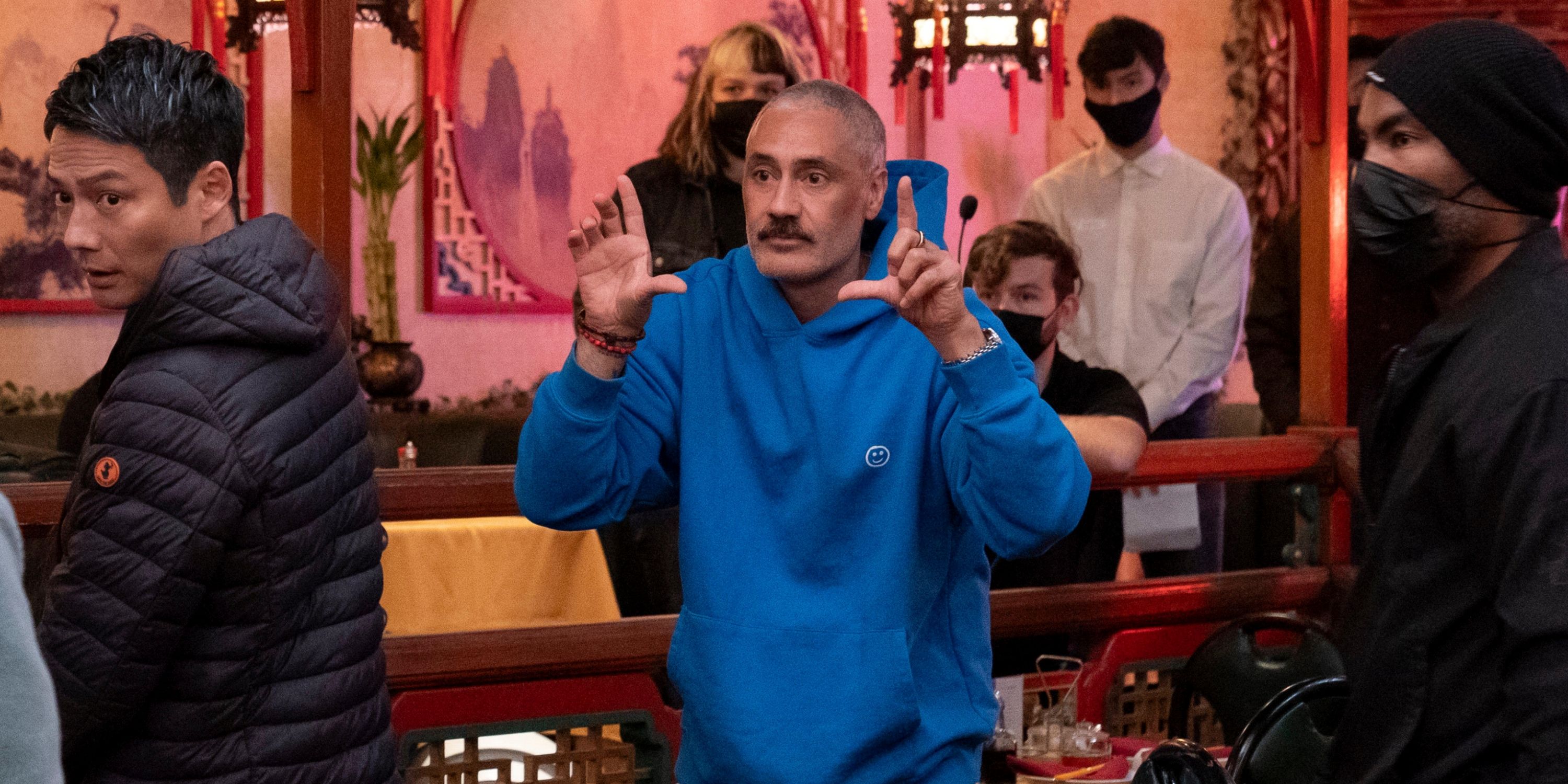 Taika Waititi directing the pilot for Interior Chinatown inside the Chinese restaurant