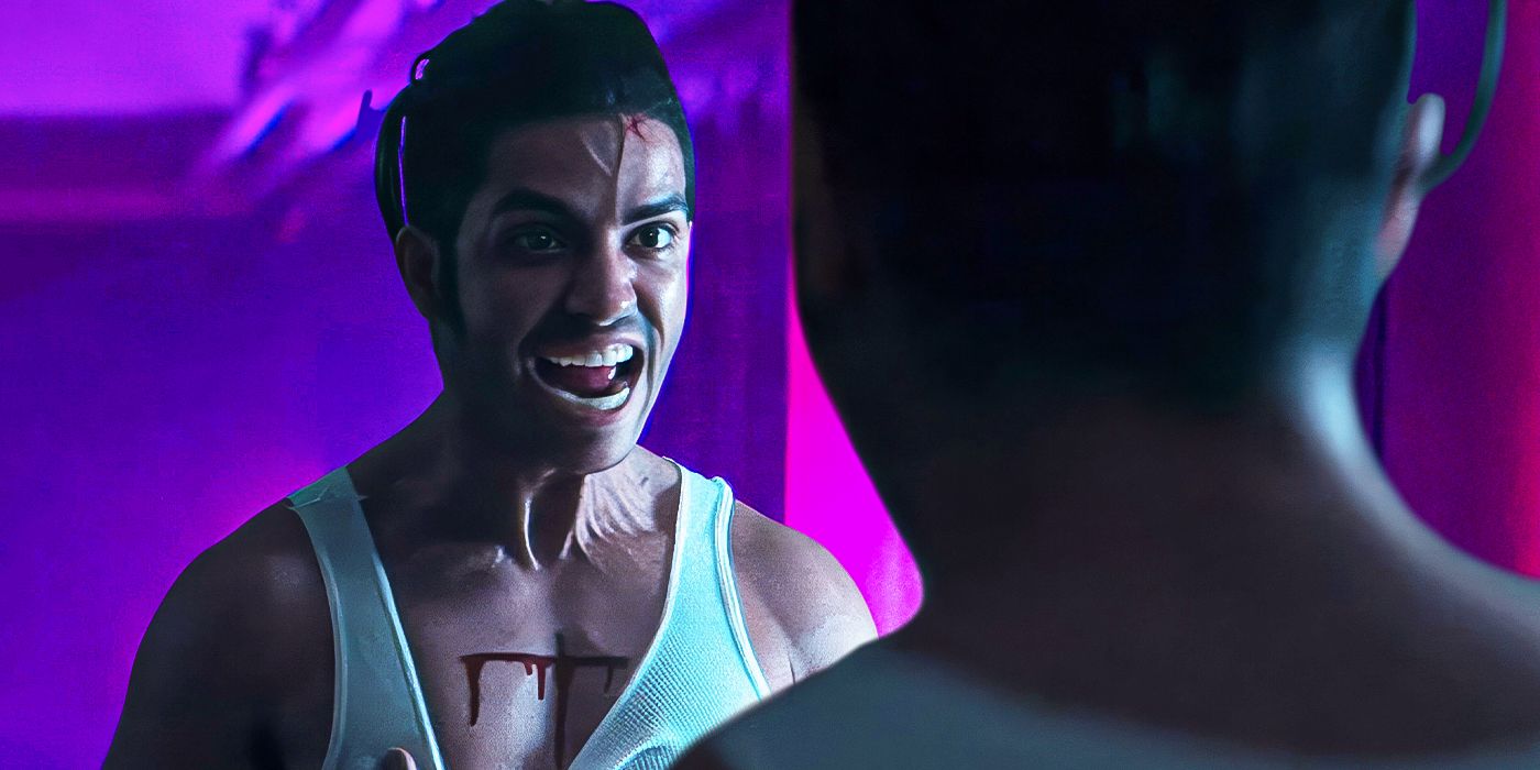 Jude, played by actor Mena Massoud, contorts his face in rage while wearing a white tank top with a cross carved into his chest in The Sacrifice Game.?