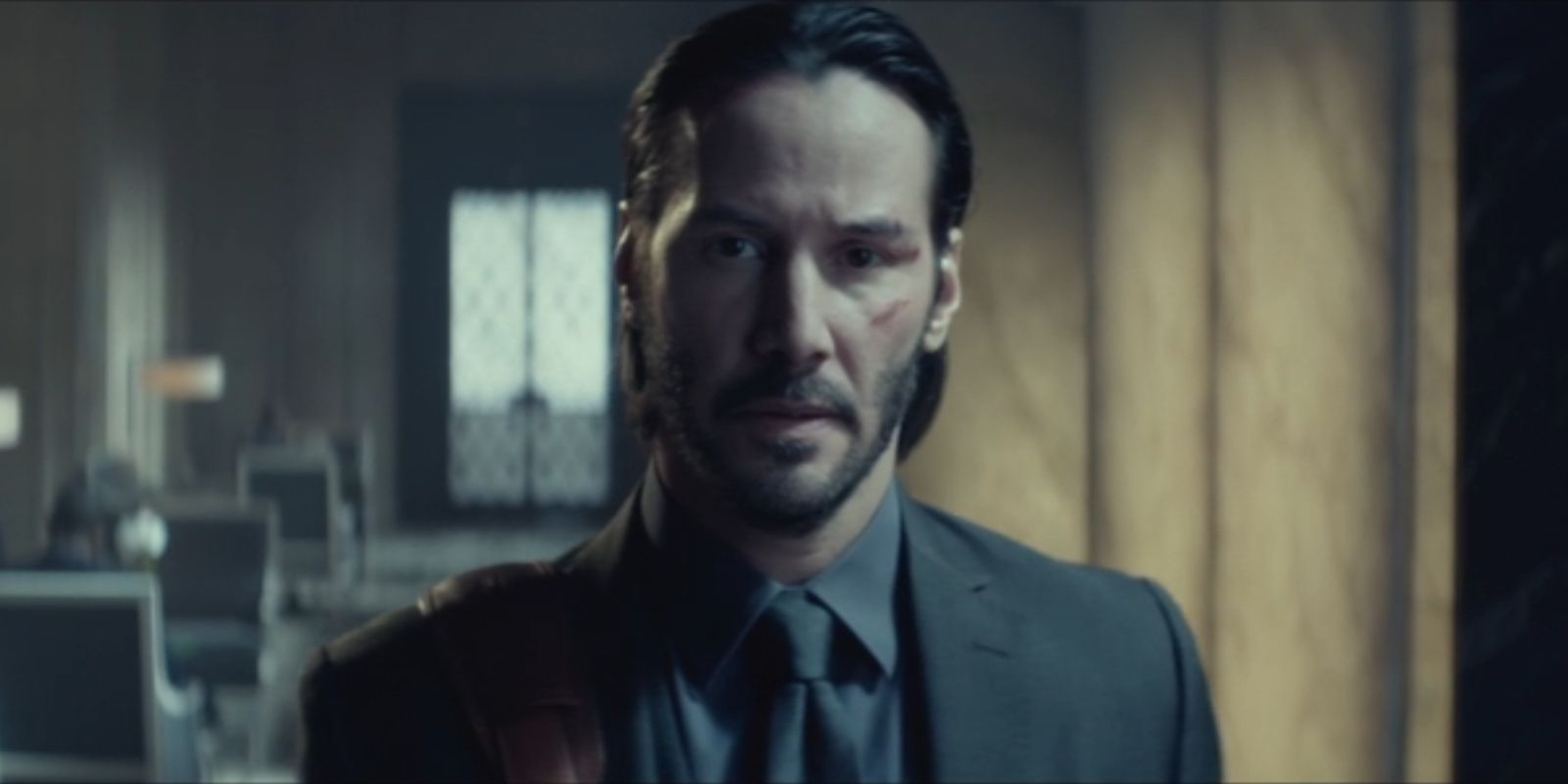 John Wick, played by Keanu Reeves, stares directly ahead in 'John Wick'.