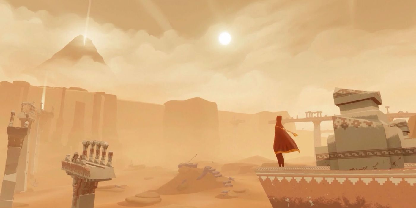 The red robed figure overlooks a vast desert filled with ruins in &lsquo;Journey&rsquo;