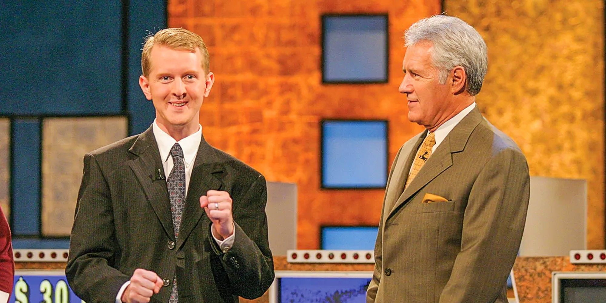 Ken Jennings and Alex Trebek standing on the Jeopardy! stage together