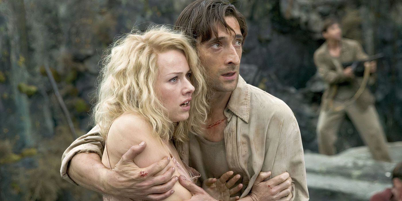 Adrien Brody holds Naomi Watts as they look at something off camera with trepidation in King Kong.