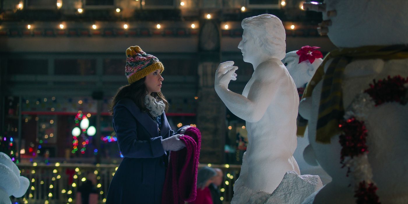 Lacey Chabert facing a snow sculpture of a sexy naked man in Hot Frosty.