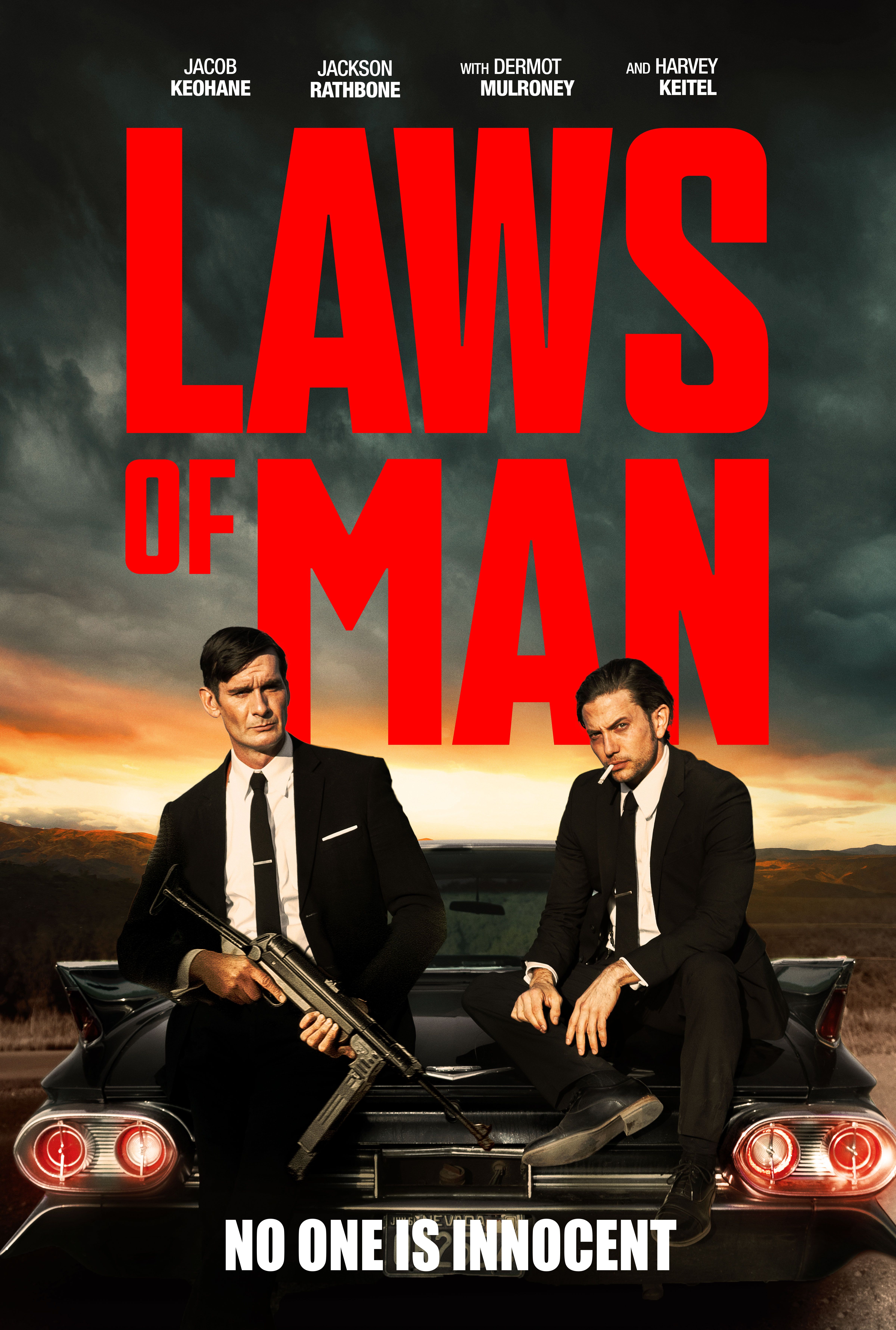 Jacob Keohane and Jackson Rathbone wear suits and sit on the back of a classic car in &lsquo;Laws of Man&rsquo; poster