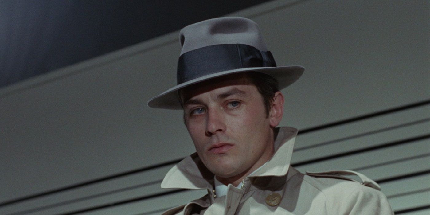 Alain Delon as Jef Costello looking at a person offscreen in Le Samourai