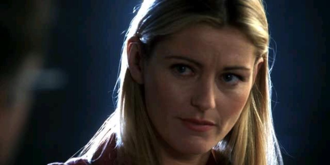 Louise Lombard stares at someone off-camera in CSI.