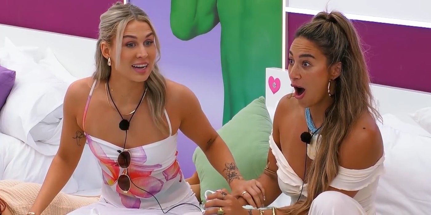 Sophie and Mimi sit on a bed and look excited and shocked on Love Island Season 6
