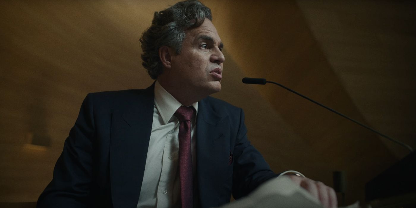Mark Ruffalo as Hieronymous Marshall speaking at a podium in Mickey 17.