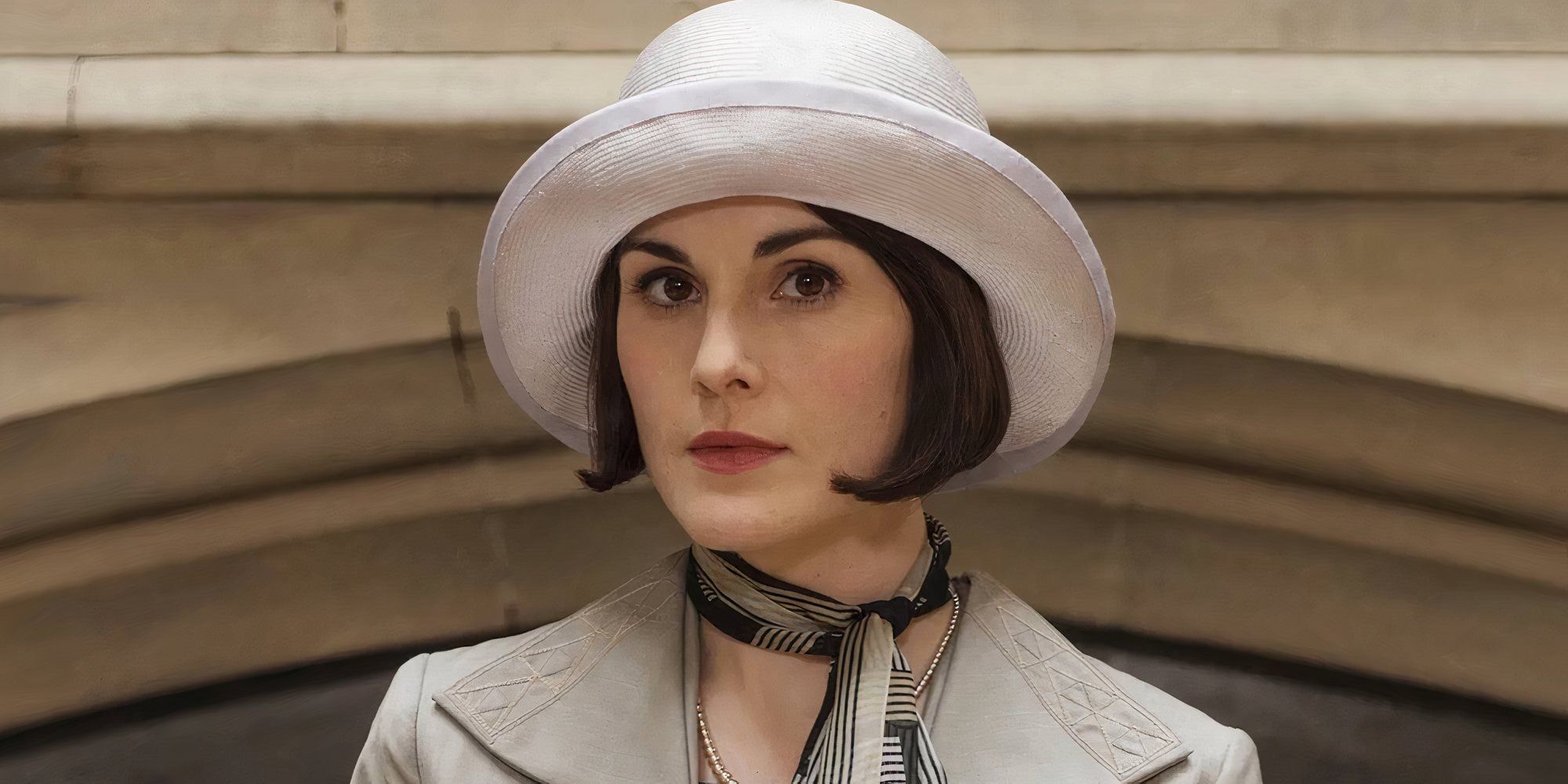 Michelle Dockery in Downton Abbey looking at the camera.