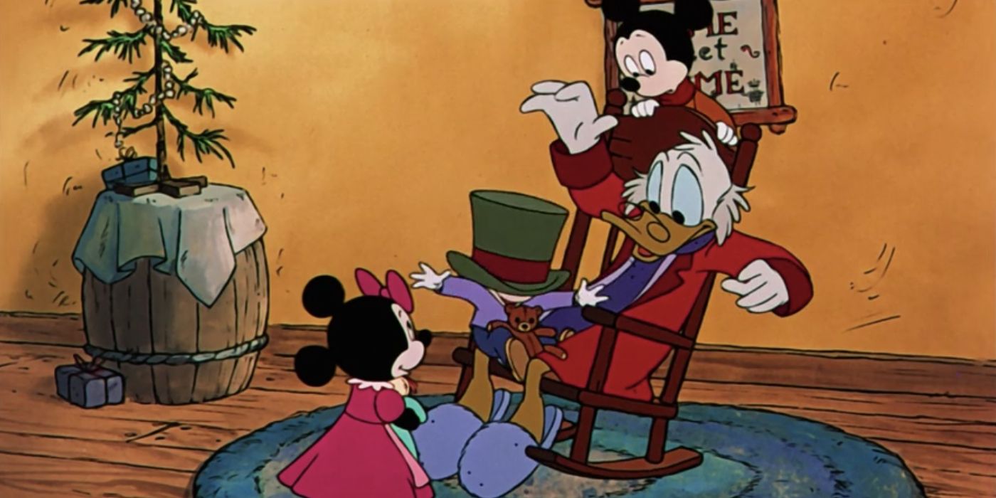 Scrooge McDuck plays with children as he sits in a rocking chair in Mickey's Christmas Carol.