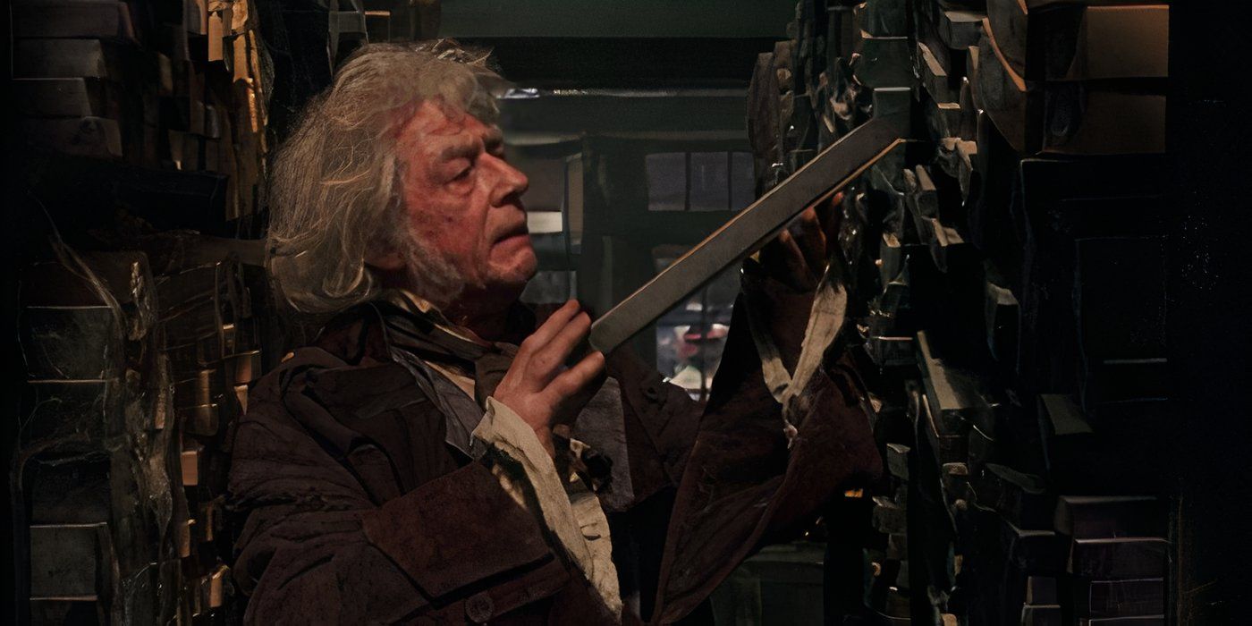 John Hurt as Ollivander draws a wand box from a shelf in Harry Potter and The Philosopher&rsquo;s Stone.