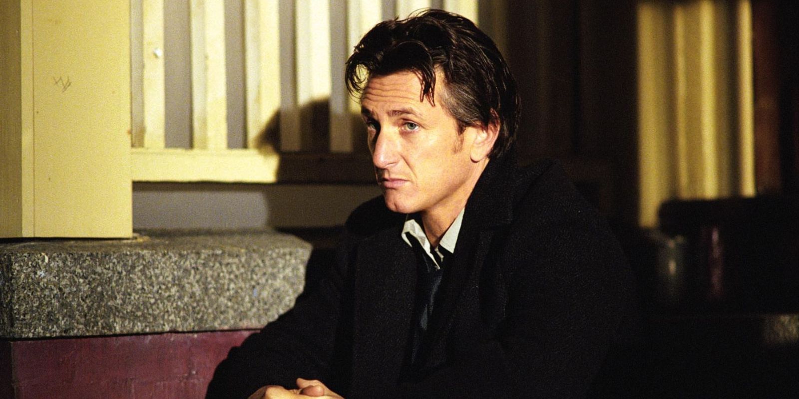 Jimmy Markum (Sean Penn) sits on the steps out the front of a house at night in &lsquo;Mystic River&rsquo; (2003).