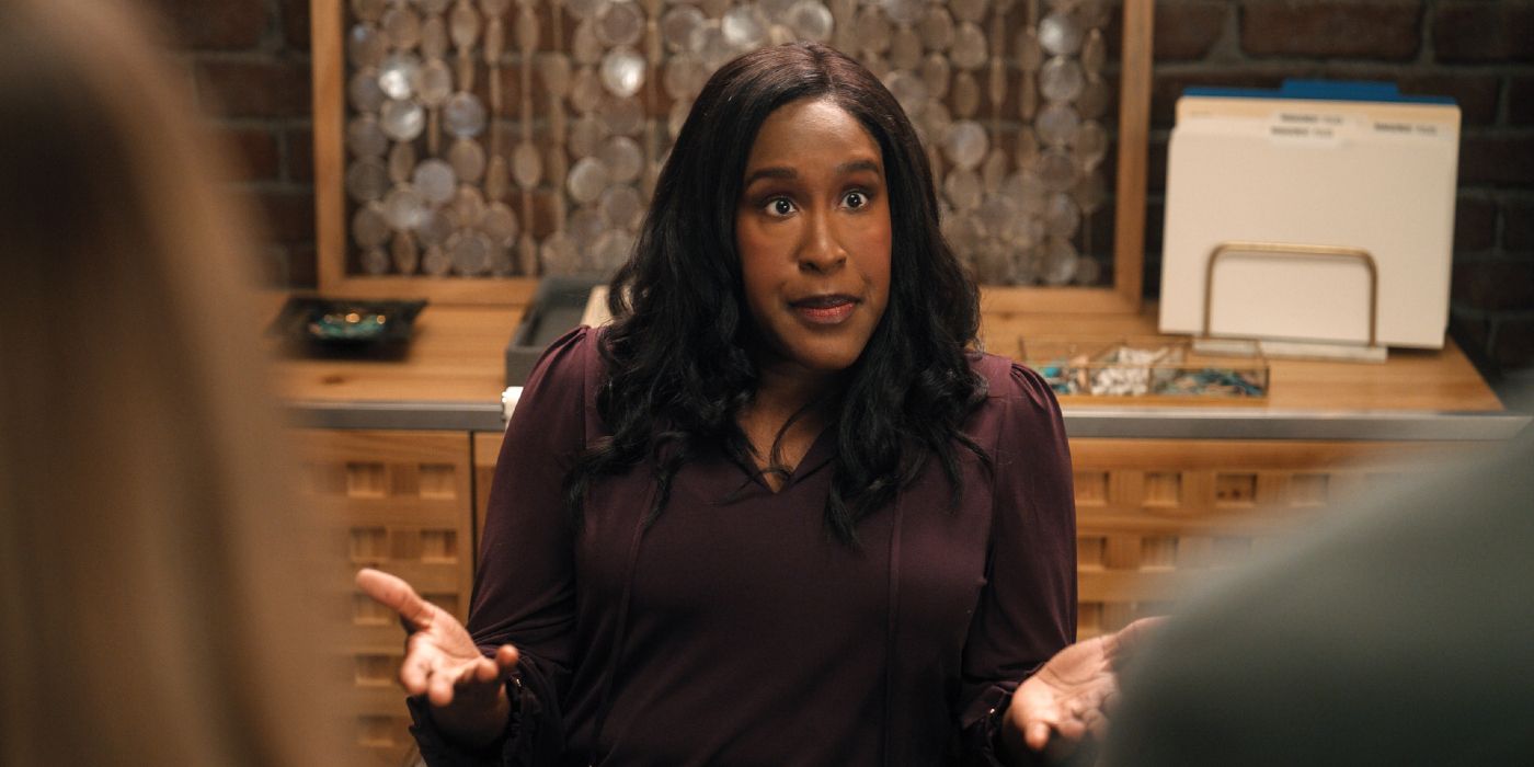 Naomi Ekperegin explaining something in front of her desk in Mythic Quest Season 4