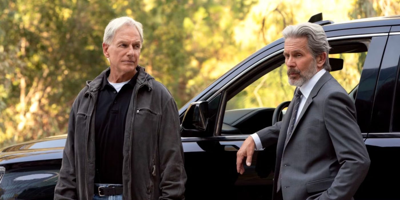 Leroy Jethro Gibbs (Mark Harmon) standing by a black SUV with Alden Parker (Gary Cole) in NCIS