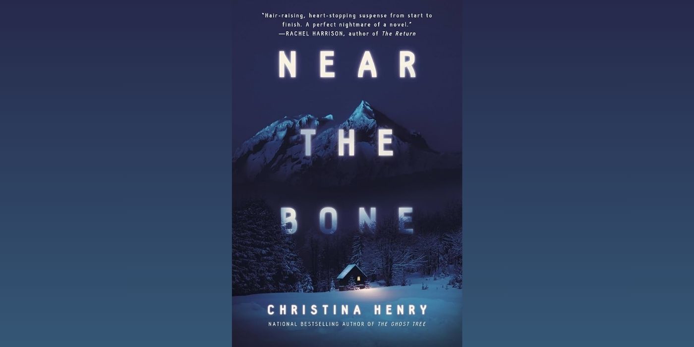 The cover of the novel Near The Bone by Christina Henry, which features a small cabin surrounded by snowy mountains