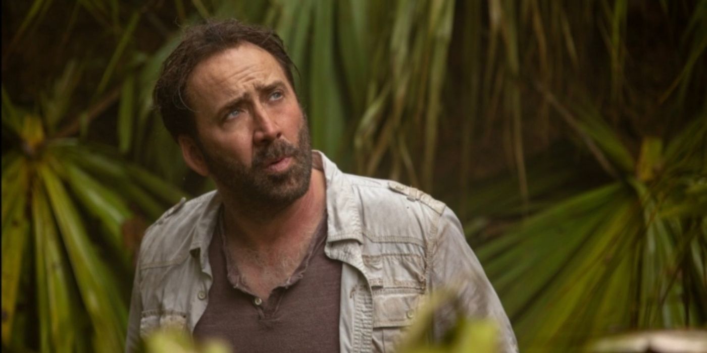 Nicolas Cage standing in the jungle in Primal