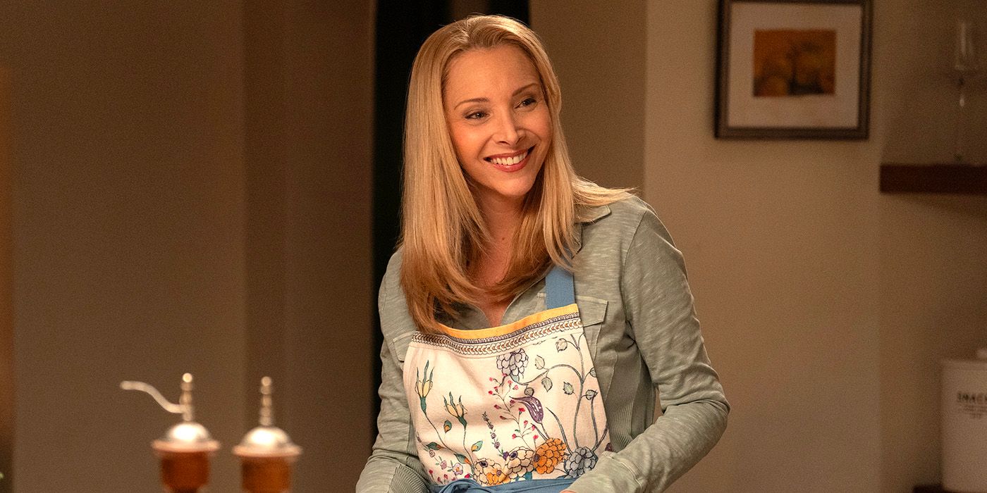 Lisa Kudrow standing in a kitchen and smiling in No Good Deed