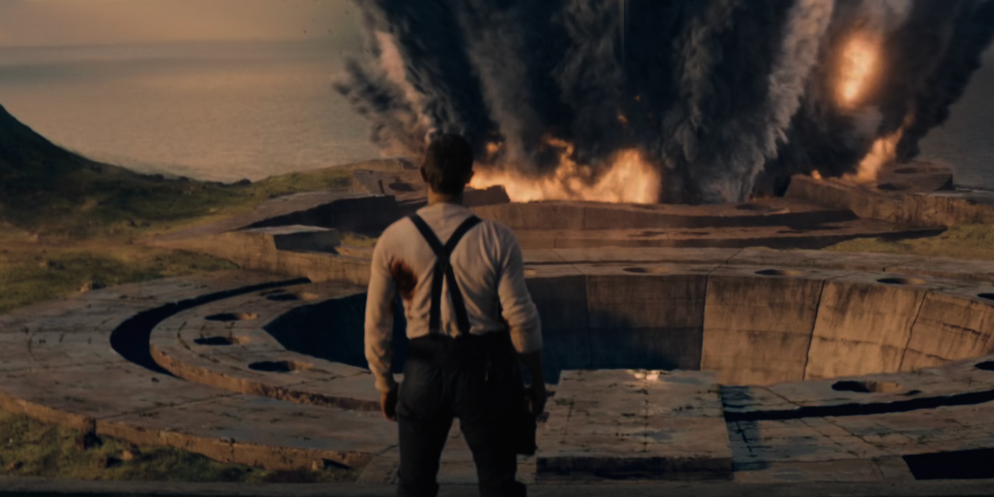 James Bond, played by Daniel Craig, watches an explosion in 'No Time to Die'.