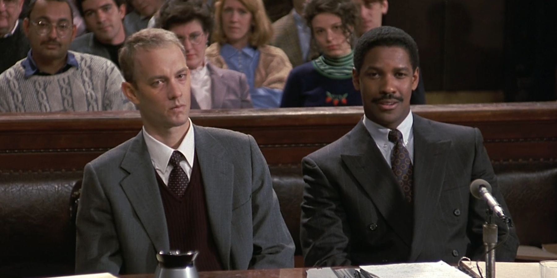 Andrew Beckett, played by Tom Hanks, sits by Joe Miller, played by Denzel Washington, in court in 'Philadelphia'.