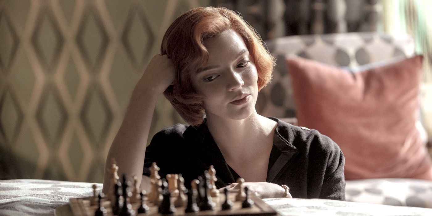 Beth looking down at a chess board in The Queen&rsquo;s Gambit