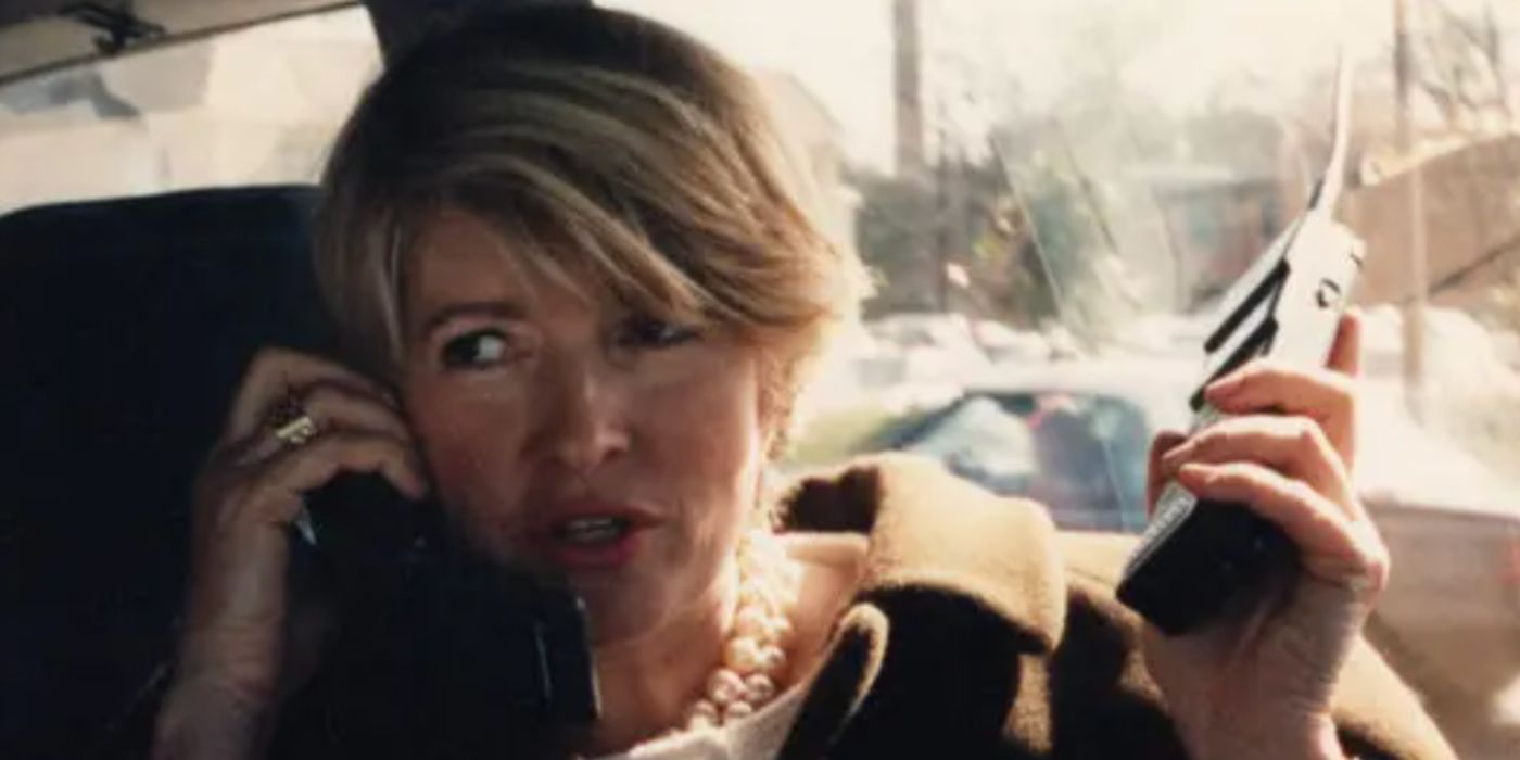 Martha Stewart on the phone in a car wearing a pearl necklace in &lsquo;Martha&rsquo;