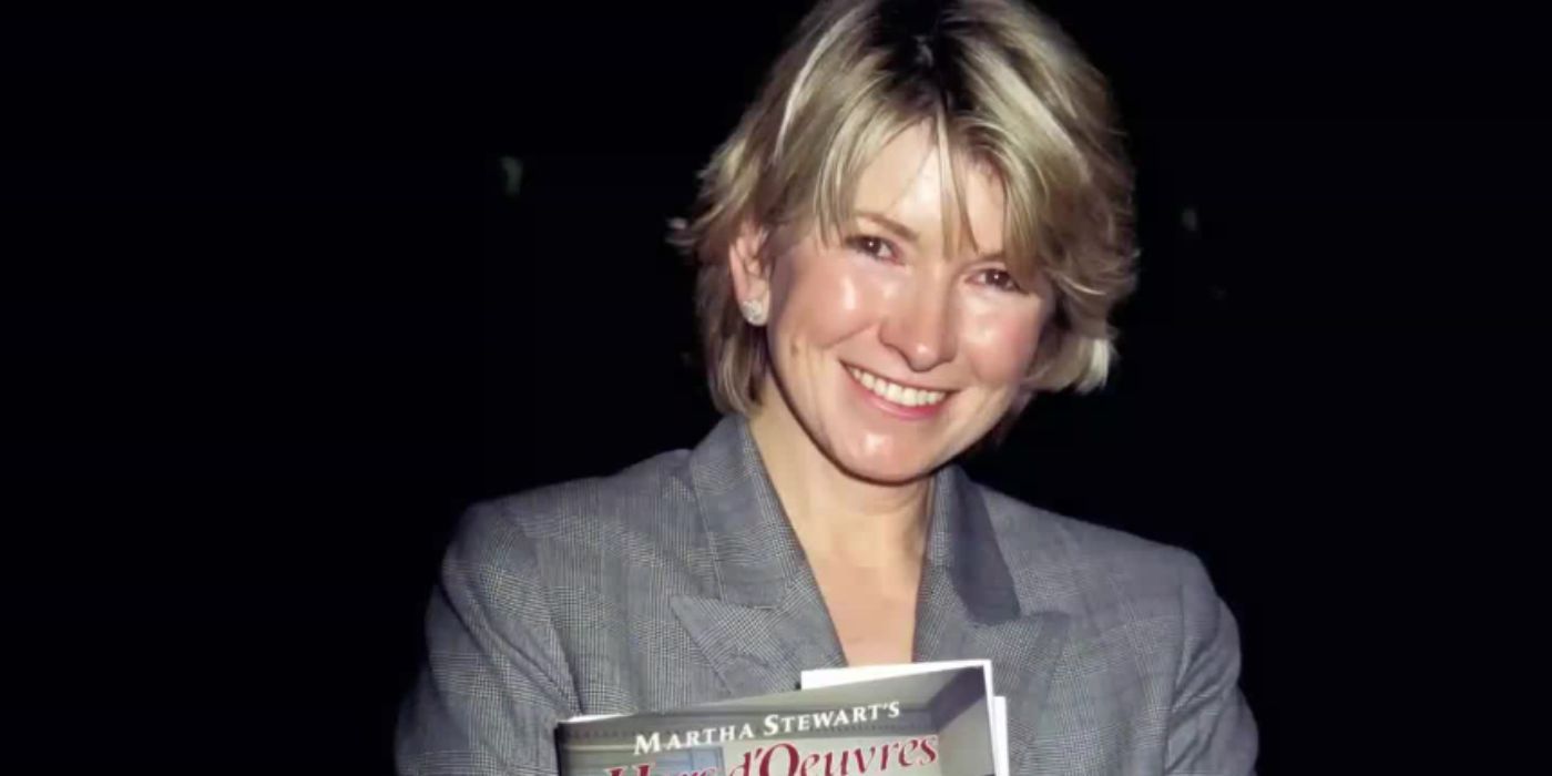 Martha Stewart smiling wearing a grey suit in 'Martha'