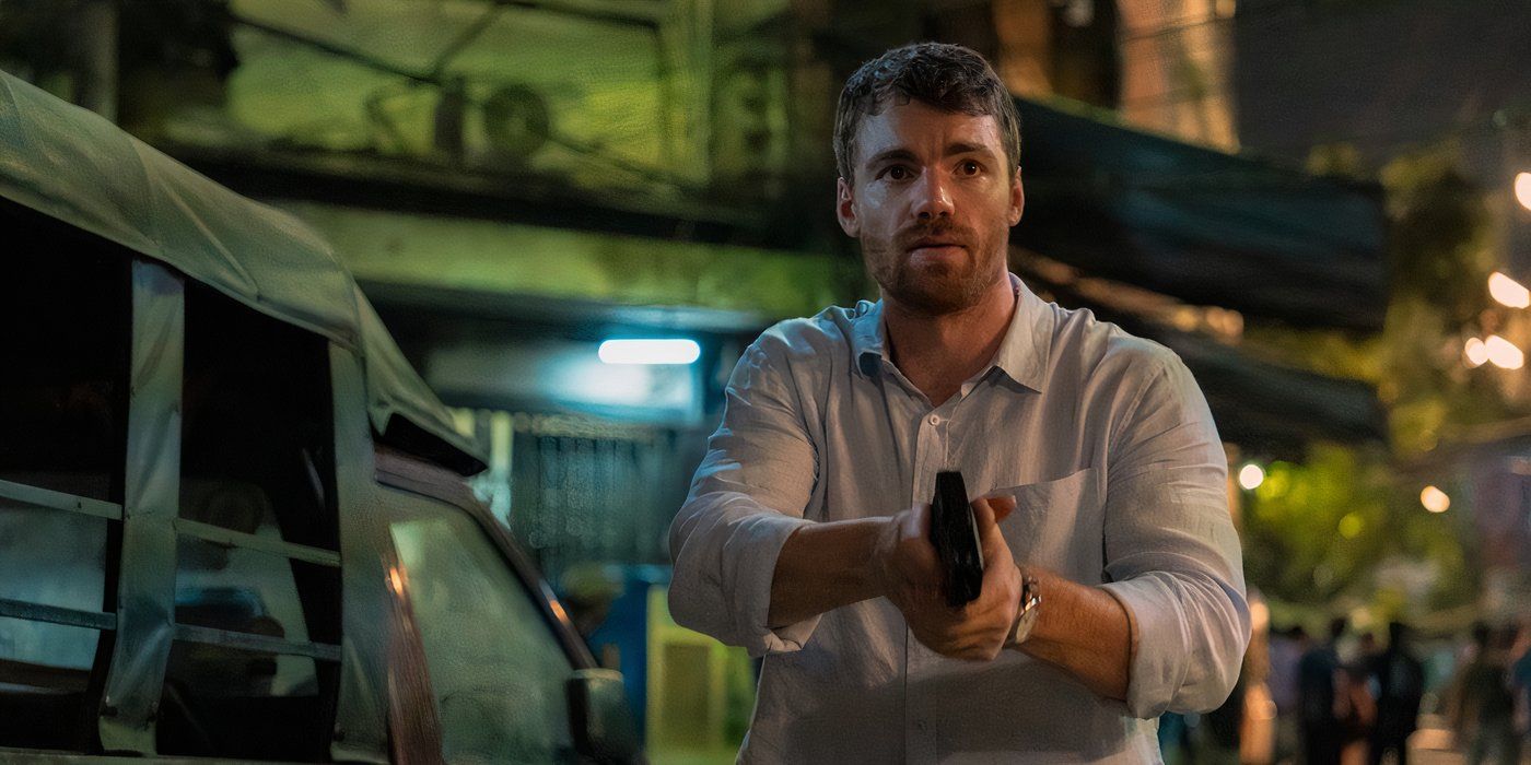 Gabriel Basso as Peter holding a gun in 'The Night Agent'