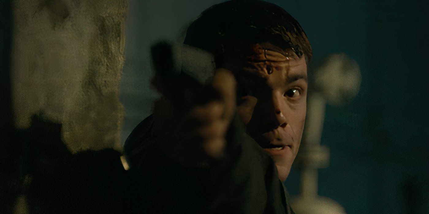 Gabriel Basso as Peter Sutherland shooting a gun in 'The Night Agent'