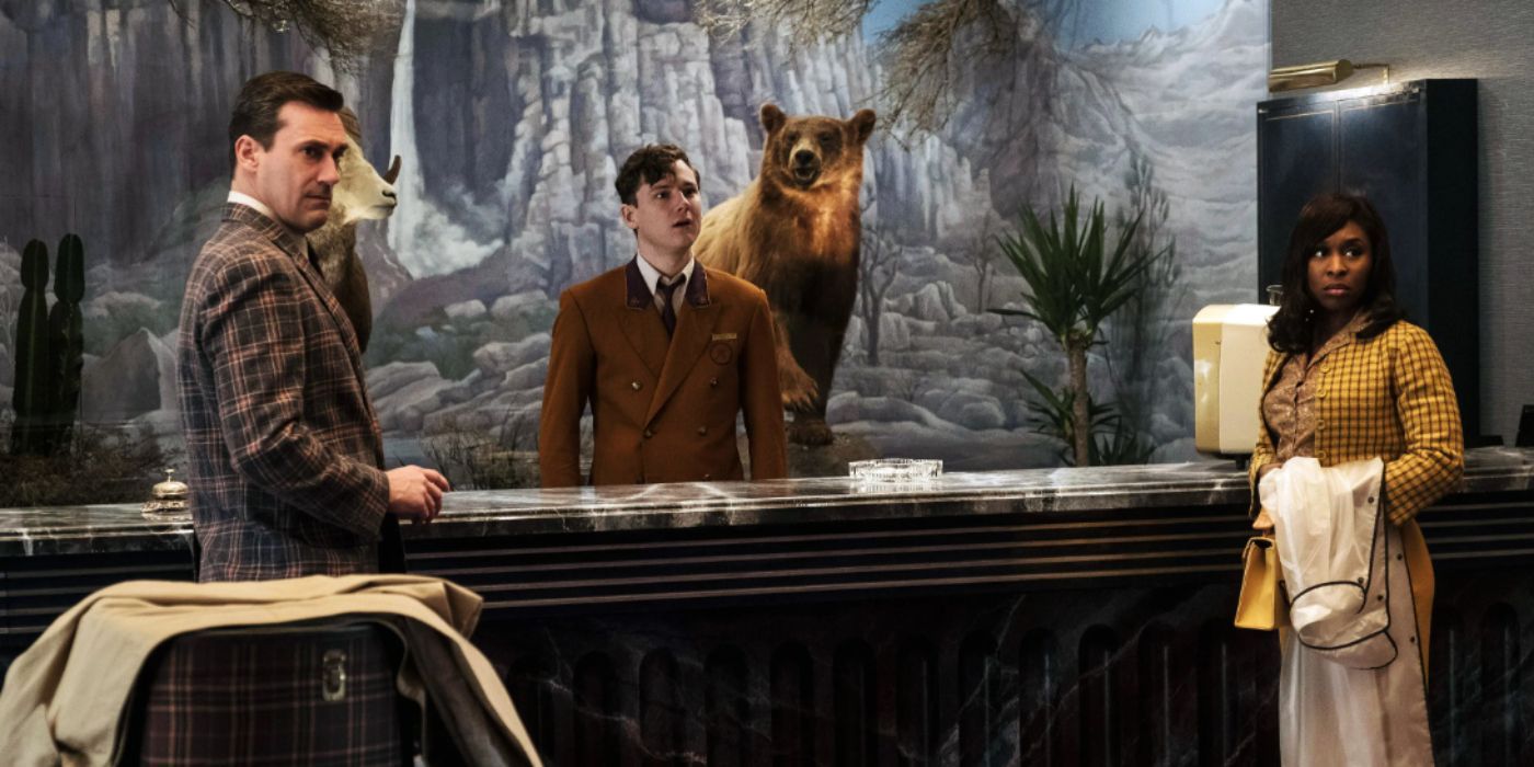 Jon Hamm, Lewis Pullman, Cynthia Erivo as Laramie, Miles, and Darlene Sweet standing in the hotel lobby in &lsquo;Bad Times at the El Royale&rsquo;