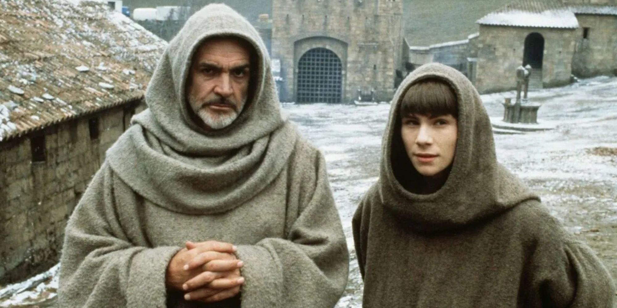 Sean Connery and Christian Slater standing next to each other in The Name of the Rose (1986)