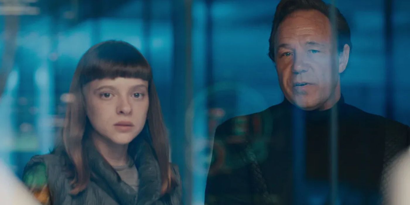 Shira Haas and Stephen Graham look at something behind glass in Bodies