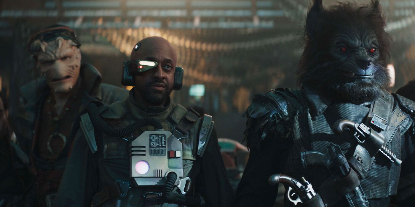 Jaleel White in a futuristic costume next to two characters of other Star Wars species in Skeleton Crew