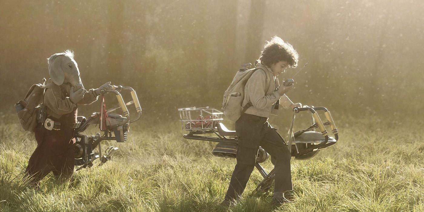 Neel (Robert Timothy Smith) and Wim (Ravi Cabot-Conyers) walking through a grassy field with bikes