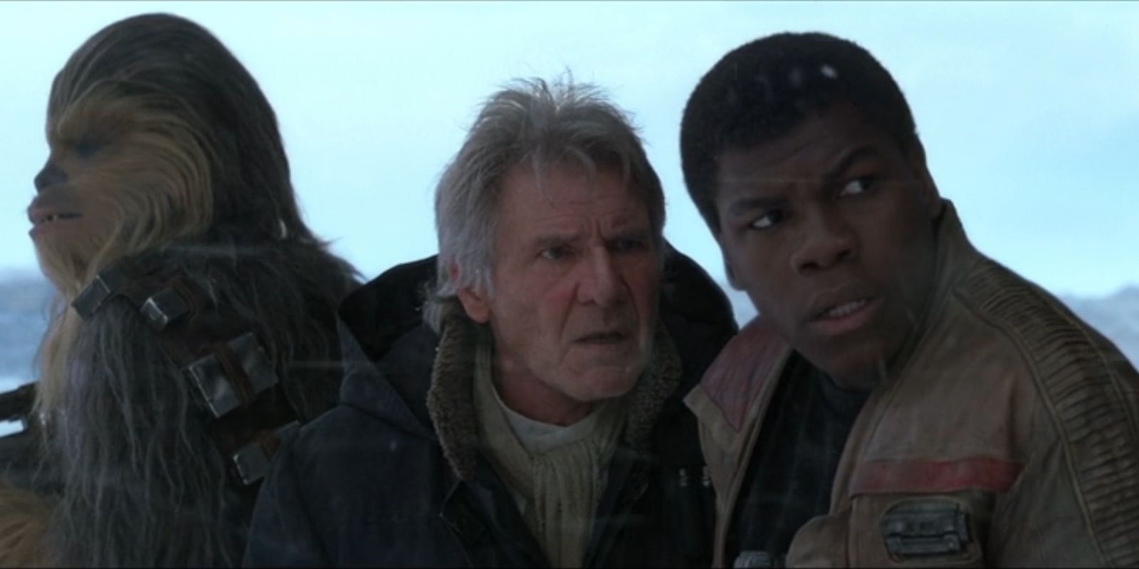 Chewbacca, Han Solo and Finn stand together in the snow in &lsquo;Star Wars: The Force Awakens&rsquo;.