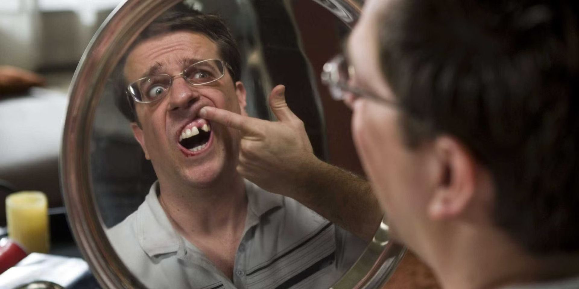 Stu-staring-at-the-gap-in-his-teeth-in-mirror in The Hangover