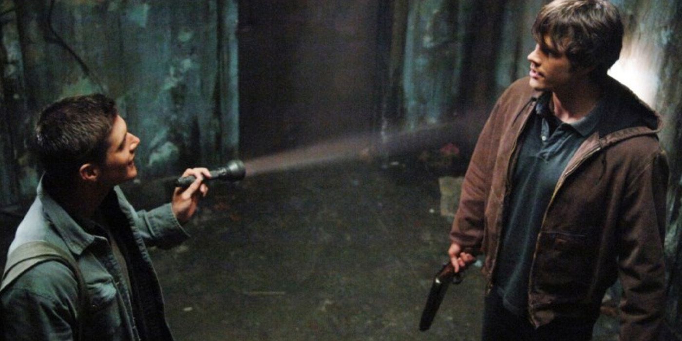 Dean Winchester (Jensen Ackles) flashes a light at his brother Sam (Jared Padalecki) in &lsquo;Supernatural&rsquo;