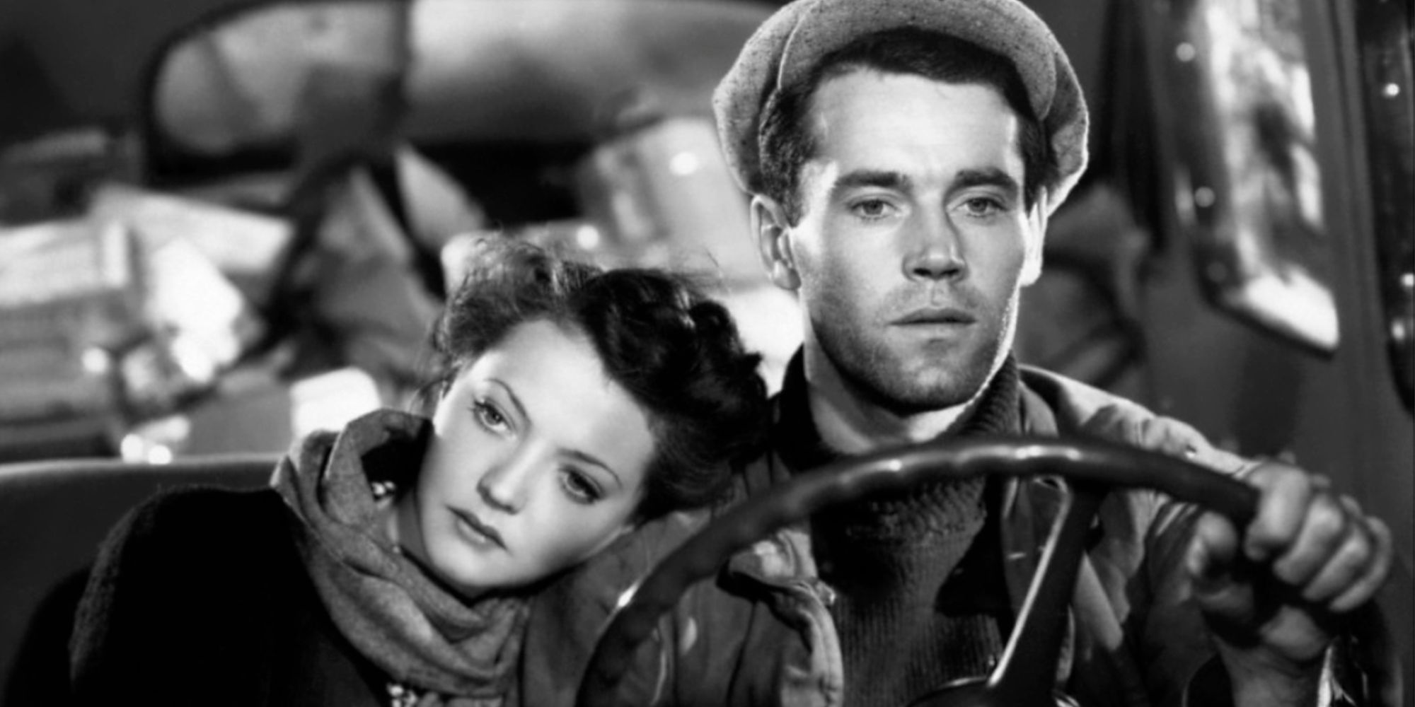 Sylvia Sidney sitting next to Henry Fonda in a car resting her head on his shoulder while he is driving in You Only Live Once (1937)