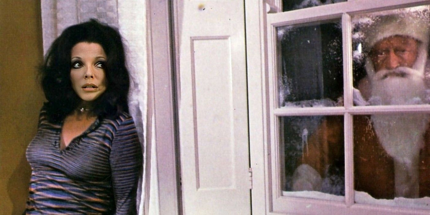 Joanne (Joan Collins) hides from a killer Santa (Oliver MacGreevy) in &lsquo;Tales From the Crypt&rsquo;